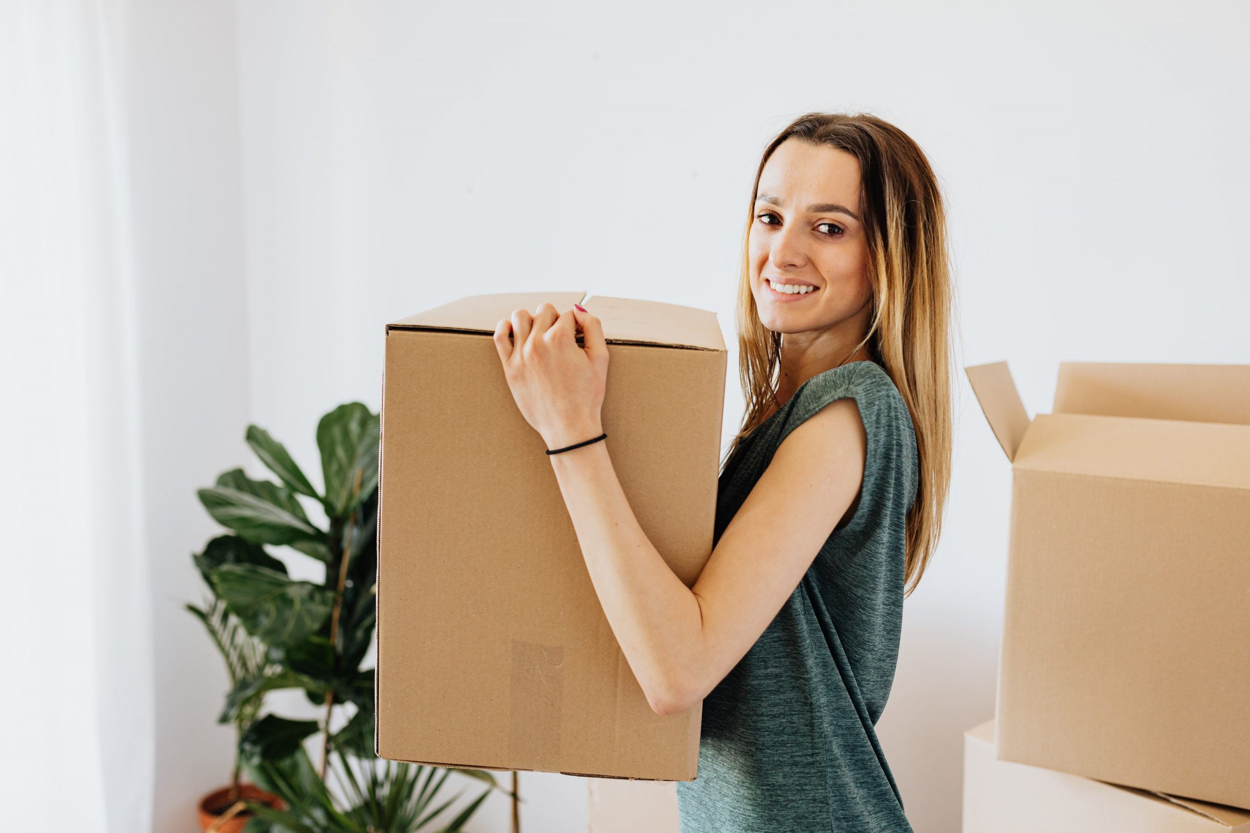 Person carrying cardboard box