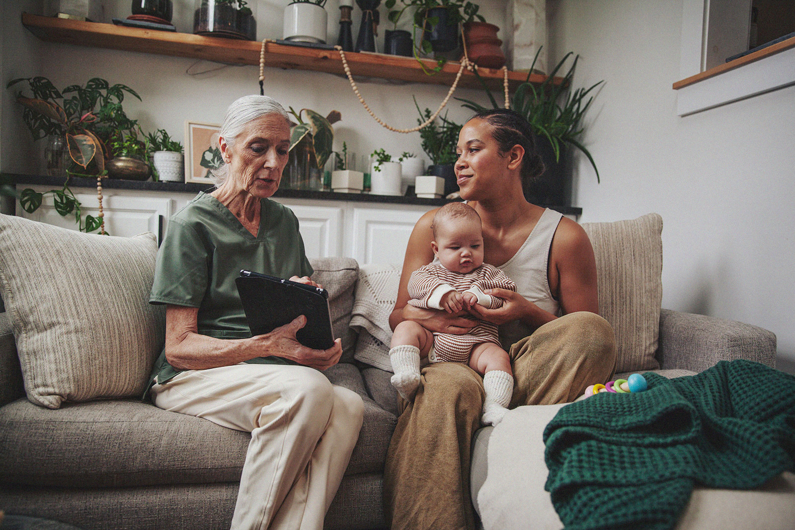 A mother enjoys an in-home consultation with an IBCLC